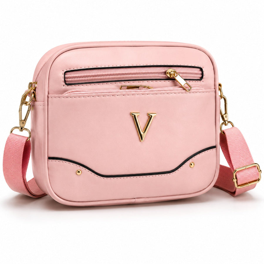 Bolso cruzado rosado con correa ajustable y detalles dorados