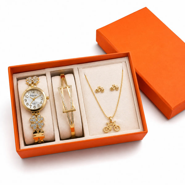 Set de accesorios en caja con reloj, pulsera, collar y aretes dorados